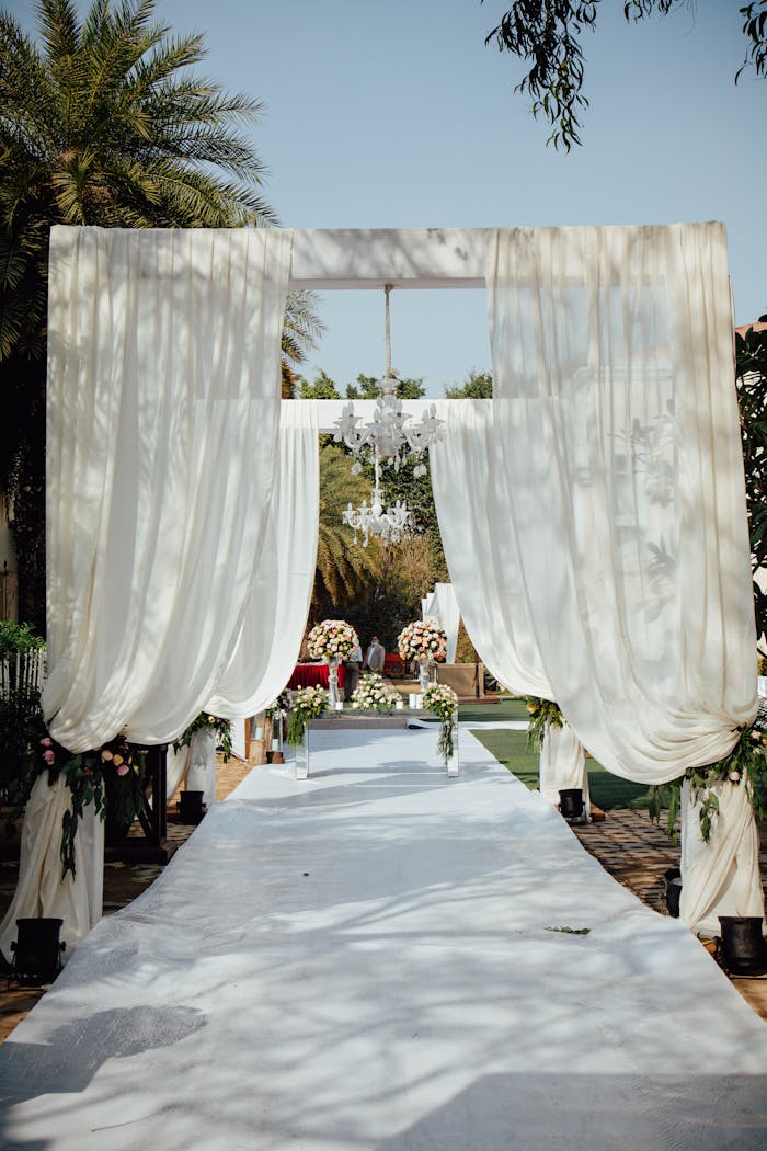elegant-outdoor-wedding-ceremony-setup-in-garden-32854443