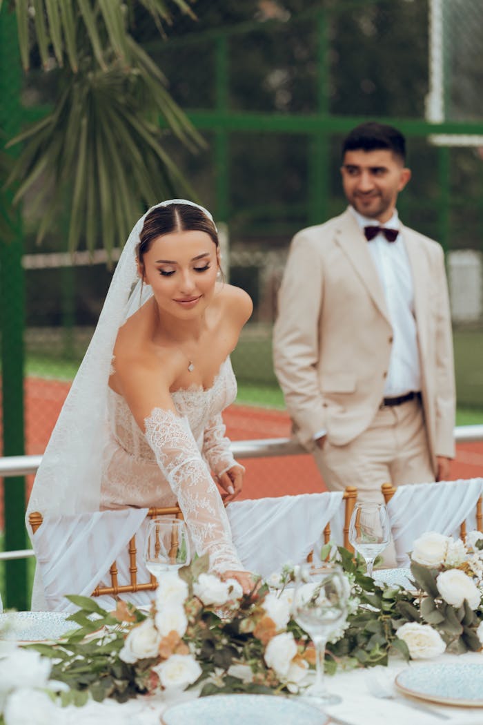 Beautiful moment of bride and groom celebrating their wedding outdoors with elegant decor.